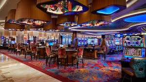 Live dealer croupier hosting a baccarat game on castletoto slot with real-time chat and game interface visible